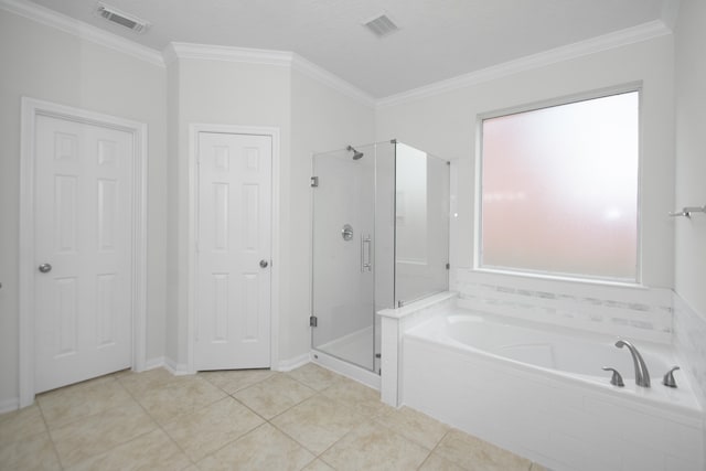 bathroom featuring plus walk in shower, tile patterned floors, a healthy amount of sunlight, and ornamental molding