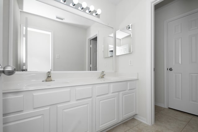 bathroom with vanity and tile patterned floors