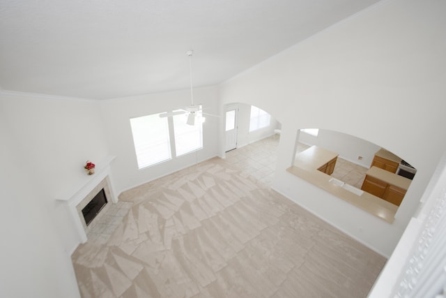 living room with ornamental molding and ceiling fan