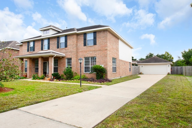 view of front facade featuring a front yard and a garage