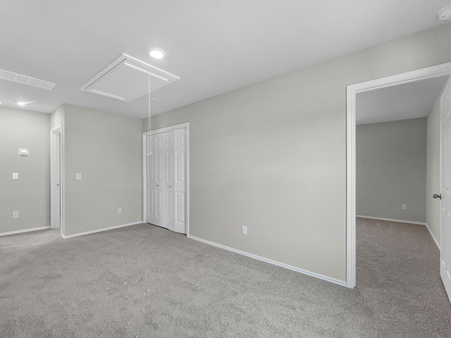 unfurnished room with light carpet