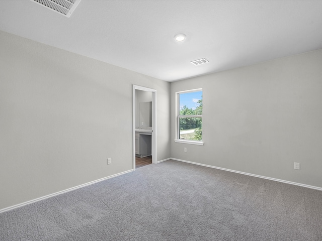 unfurnished room featuring carpet floors