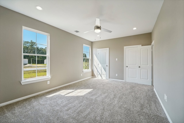 unfurnished bedroom with carpet and ceiling fan