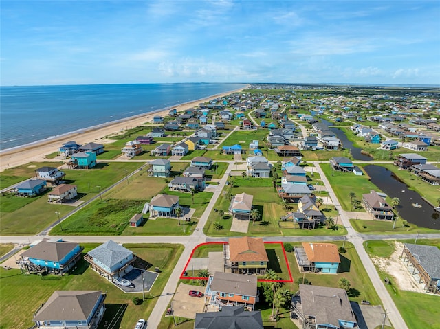 aerial view featuring a view of the beach and a water view