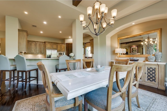 dining room with an inviting chandelier and wood-type flooring