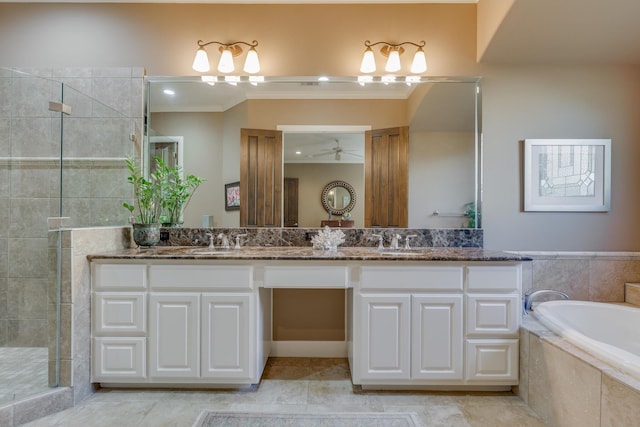 bathroom featuring vanity, ceiling fan, ornamental molding, and separate shower and tub