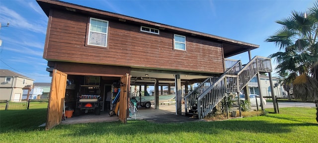 rear view of property with a yard