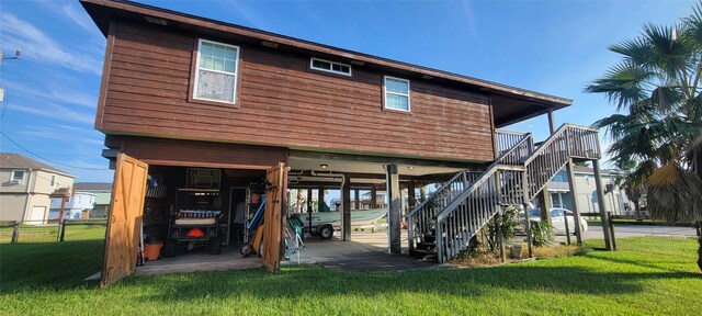 4015 Navarro Dr, Galveston, TX 77554 - exterior space featuring a carport, a lawn, fence, and stairway
