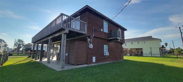 back of property featuring a lawn, a patio, and cooling unit