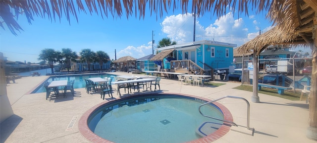 view of swimming pool with a patio area