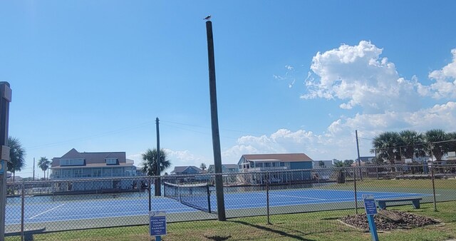 4015 Navarro Dr, Galveston, TX 77554 - view of sport court featuring fence