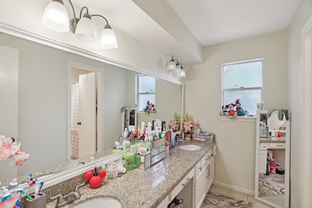 bathroom with vanity and curtained shower