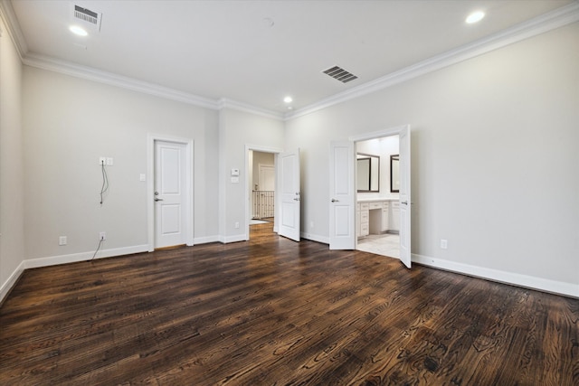 unfurnished bedroom with crown molding, ensuite bathroom, and dark hardwood / wood-style flooring