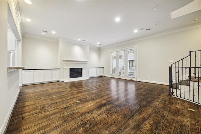 unfurnished living room with crown molding and dark wood-type flooring