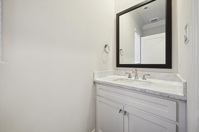 bathroom featuring vanity and crown molding