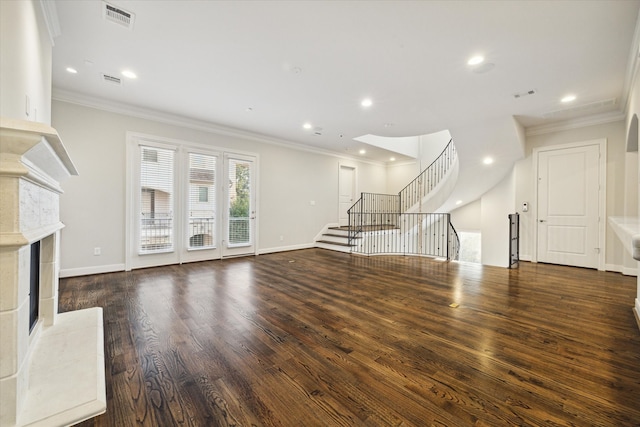 unfurnished living room featuring crown molding, dark hardwood / wood-style floors, and a premium fireplace