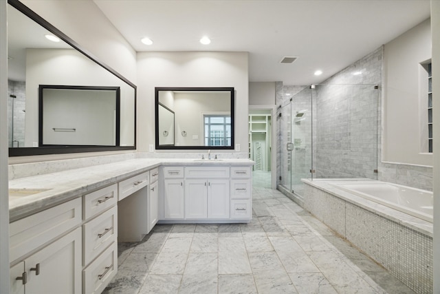 bathroom with vanity and separate shower and tub