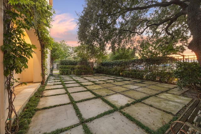 view of patio terrace at dusk