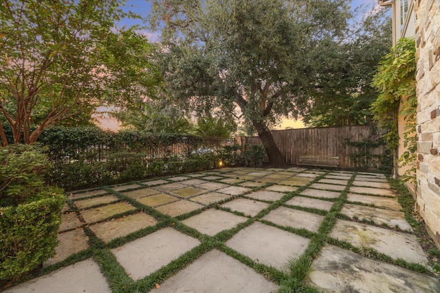 view of patio terrace at dusk