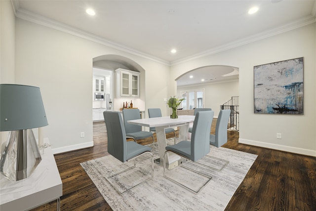 dining room featuring dark hardwood / wood-style floors and ornamental molding