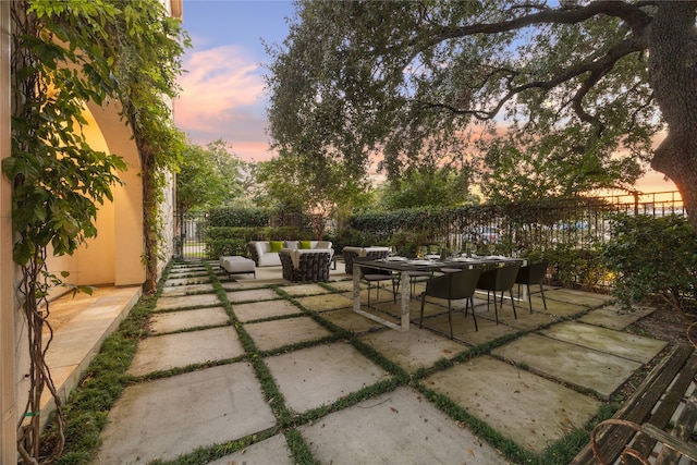 view of patio terrace at dusk