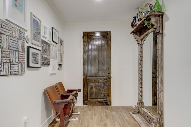 foyer featuring crown molding