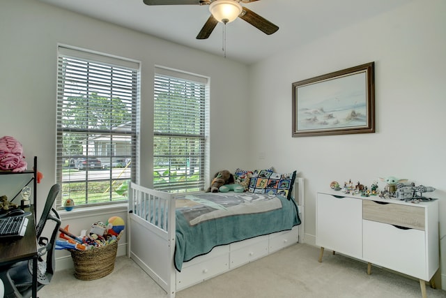 carpeted bedroom featuring ceiling fan