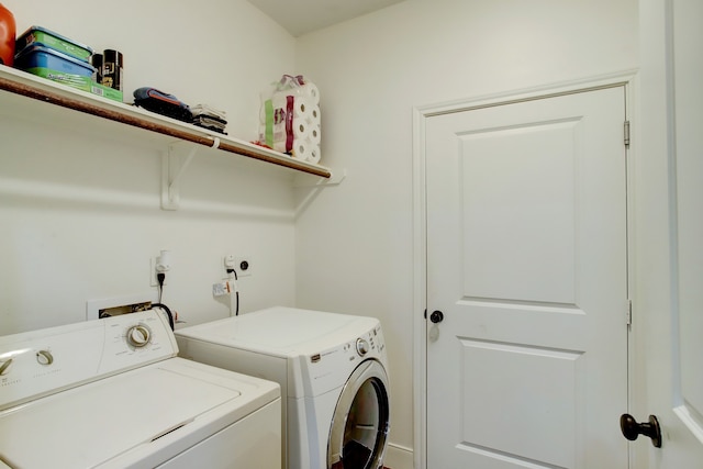 washroom with washer and dryer