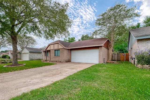 view of front of home featuring a front yard and a garage