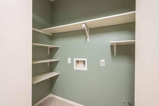 clothes washing area with hookup for a washing machine, electric dryer hookup, and light tile patterned floors