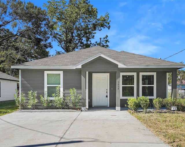 view of front of property with roof with shingles