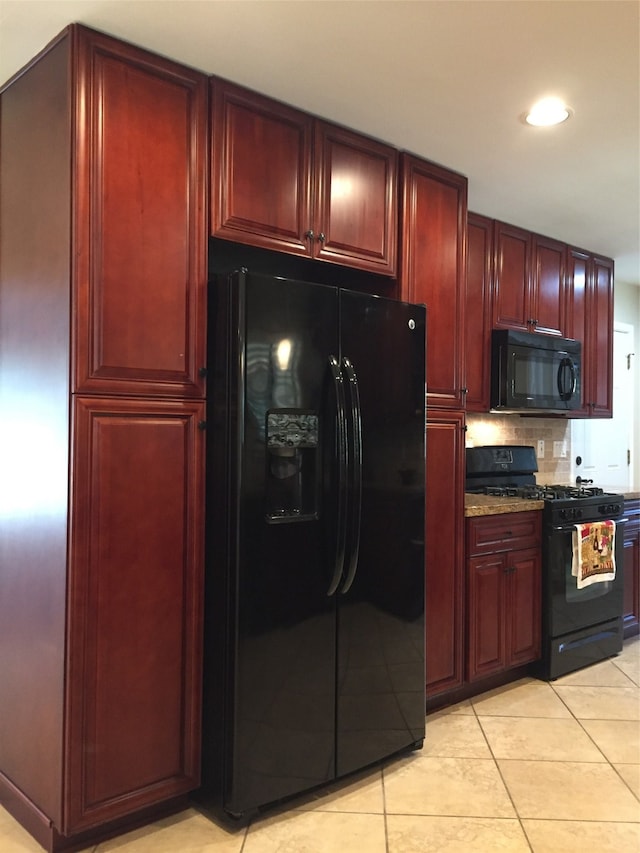 kitchen featuring black appliances, backsplash, light tile patterned floors, and light stone counters