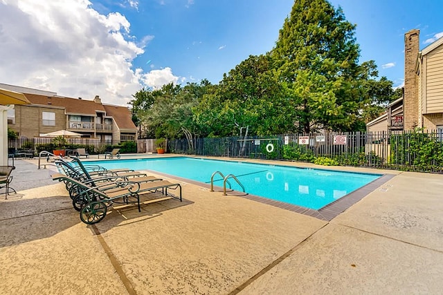 view of swimming pool featuring a patio