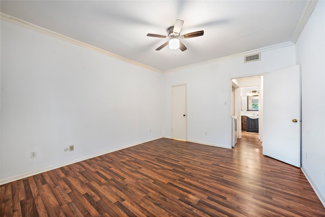 spare room featuring ornamental molding, dark hardwood / wood-style floors, and ceiling fan