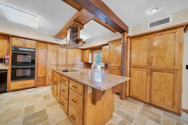 kitchen with beamed ceiling, a kitchen island, island exhaust hood, black appliances, and a kitchen bar