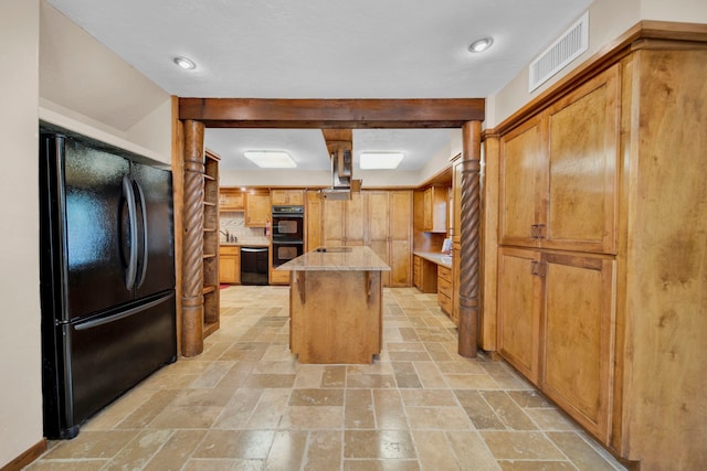 kitchen with black appliances, backsplash, a kitchen island, and beam ceiling