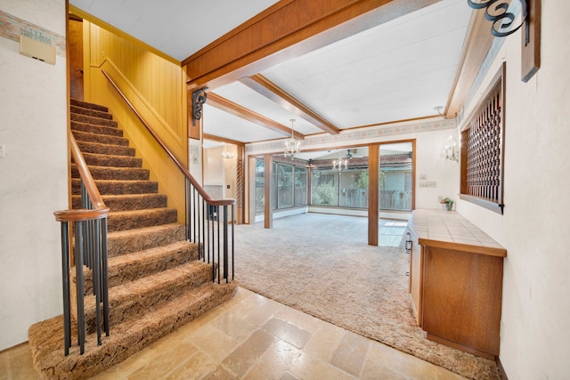 interior space featuring beam ceiling and light colored carpet