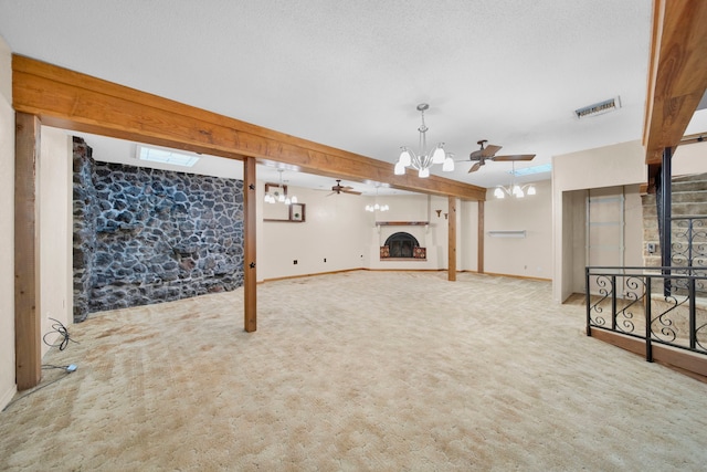 interior space with light carpet, a textured ceiling, and ceiling fan with notable chandelier