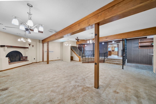 basement featuring light colored carpet and an inviting chandelier