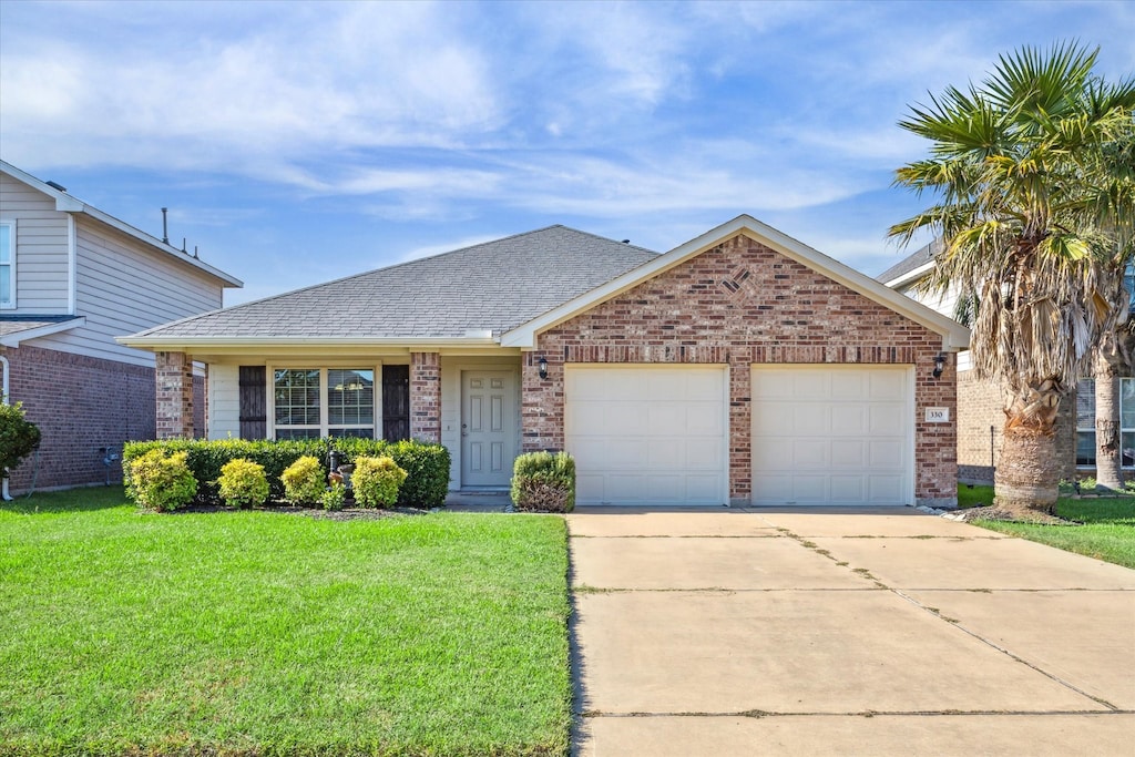 ranch-style house with a front lawn and a garage