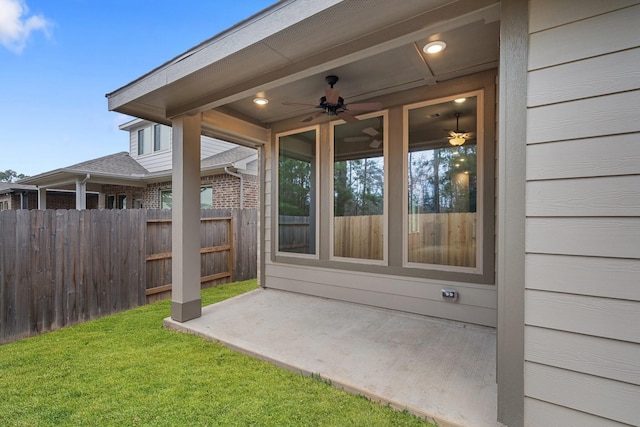 view of patio / terrace featuring fence and a ceiling fan