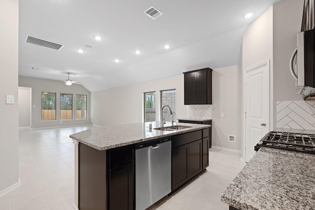 kitchen featuring stainless steel dishwasher, a center island with sink, a sink, and visible vents