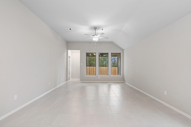 empty room featuring a ceiling fan, visible vents, baseboards, and light tile patterned flooring