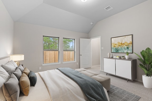 bedroom with light carpet, baseboards, visible vents, and vaulted ceiling