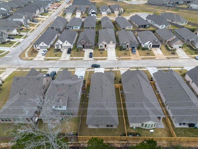 birds eye view of property with a residential view