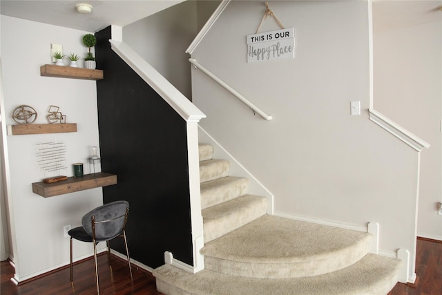 stairs with wood-type flooring