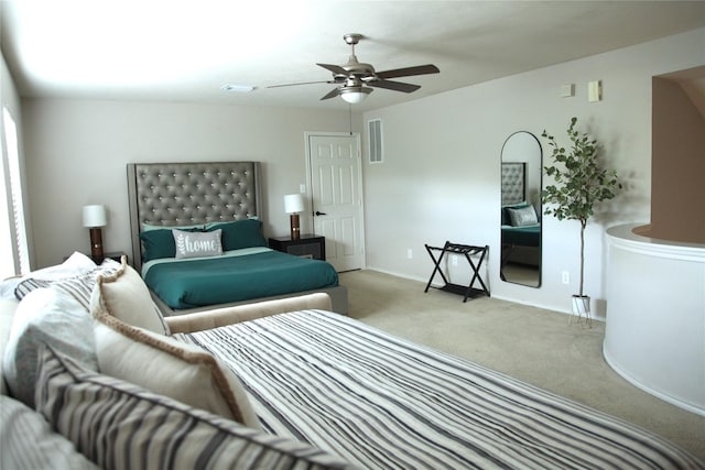 interior space with ceiling fan and light colored carpet