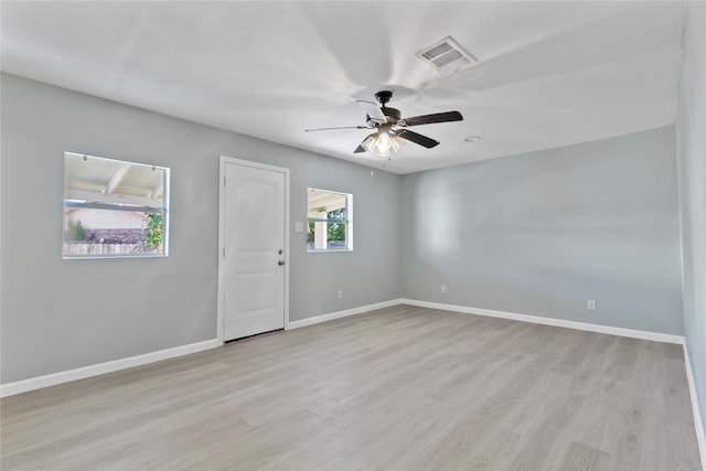 spare room with ceiling fan, light hardwood / wood-style flooring, and plenty of natural light