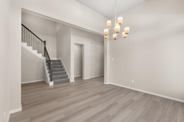 interior space with a chandelier and light wood-type flooring