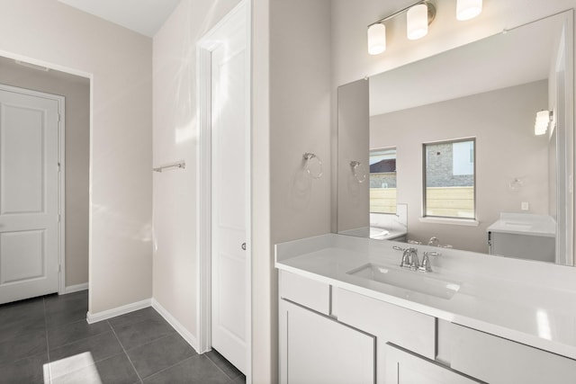 bathroom with tile patterned flooring and vanity